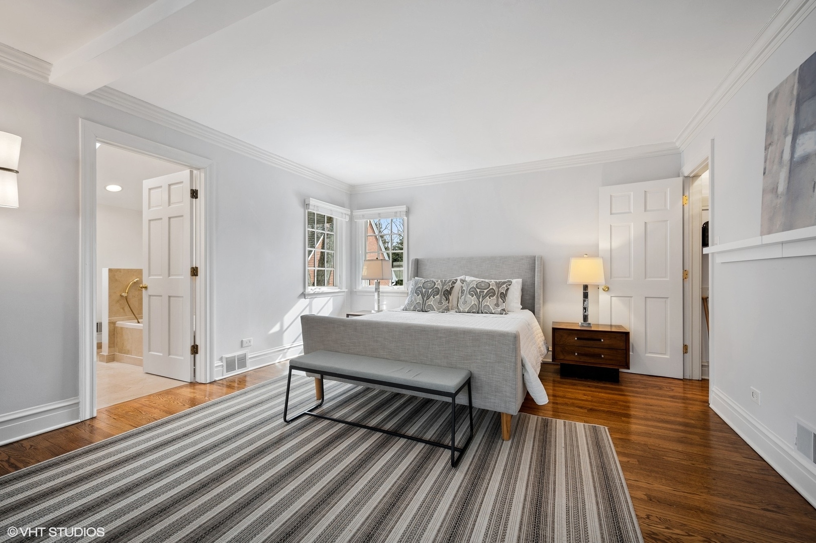 402 Willow Road Winnetka, IL 60093 - Photo 15 of 31 a bedroom with a bed and wooden floor