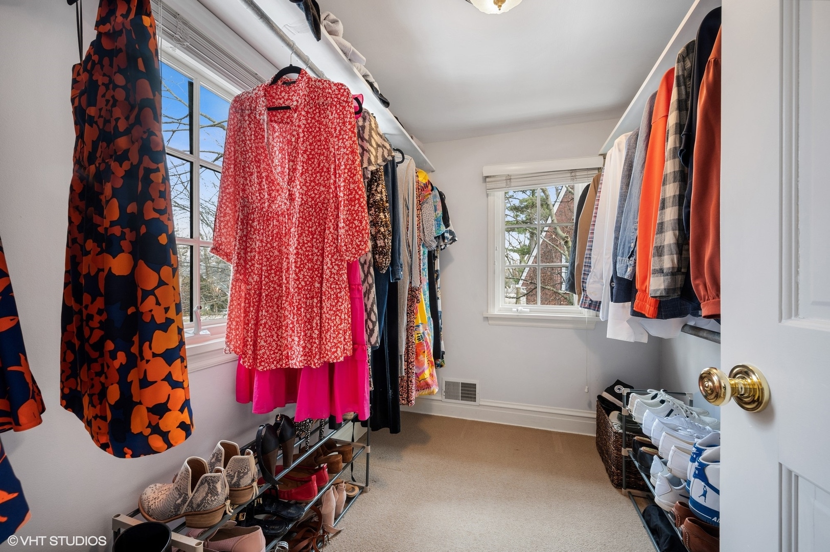 402 Willow Road Winnetka, IL 60093 - Photo 17 of 31 a view of walk in closet with clothes and shoes