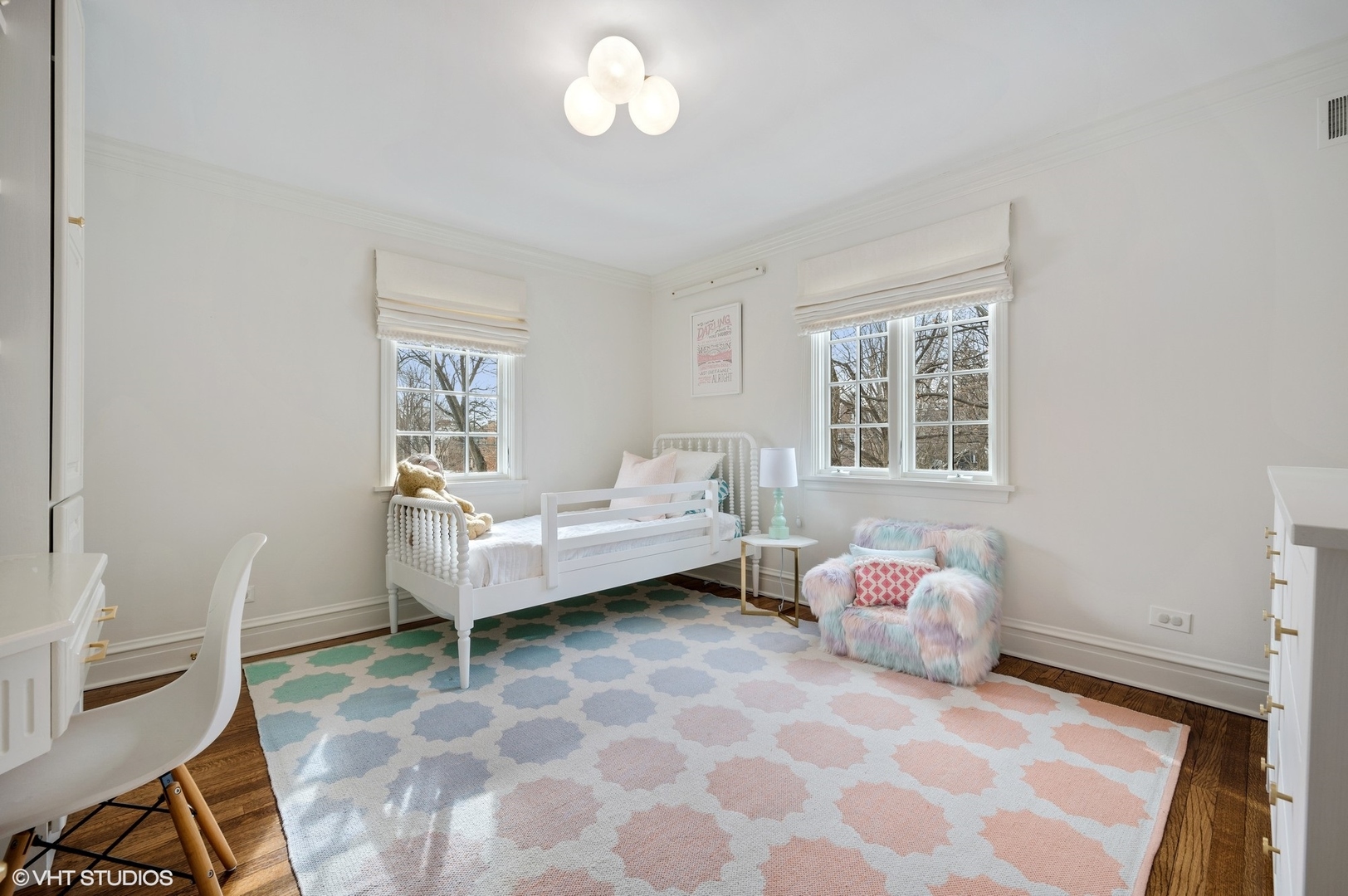 402 Willow Road Winnetka, IL 60093 - Photo 18 of 31 a bedroom with a bed and wooden floor