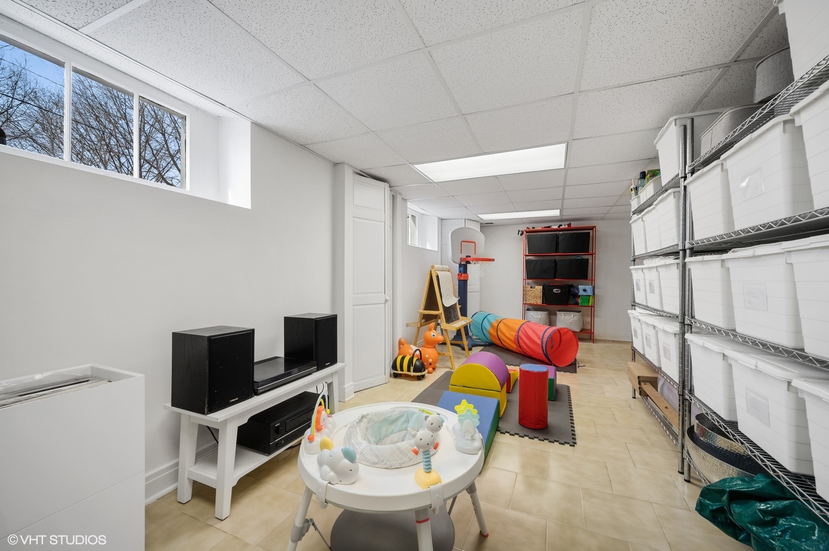 402 Willow Road Winnetka, IL 60093 - Photo 23 of 31 a room with furniture a rug toys and a window