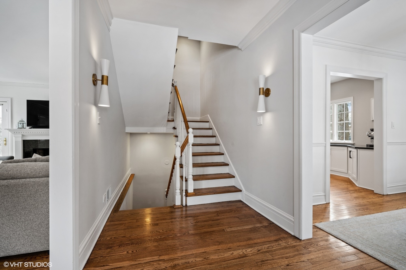 402 Willow Road Winnetka, IL 60093 - Photo 5 of 31 a view of a hallway with wooden floor and staircase