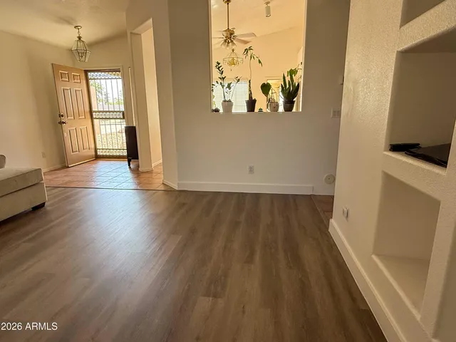 a view of a hardwood floor in a room