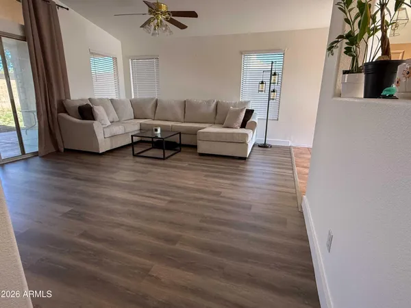 a living room with furniture and a fireplace