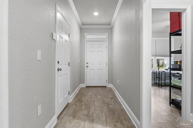 a view of hallway with wooden floor