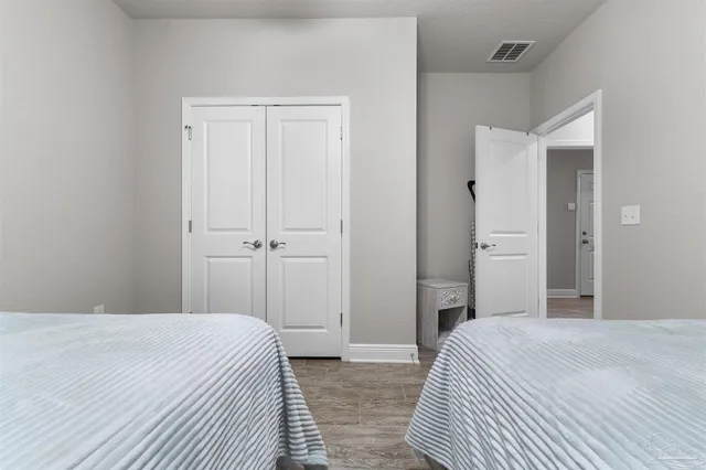 a bedroom with a bed and closet