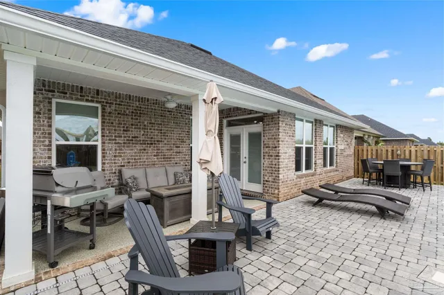 a outdoor space with patio furniture and potted plants