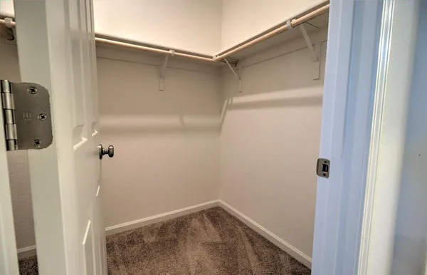 a bathroom with a sink vanity granite and a mirror