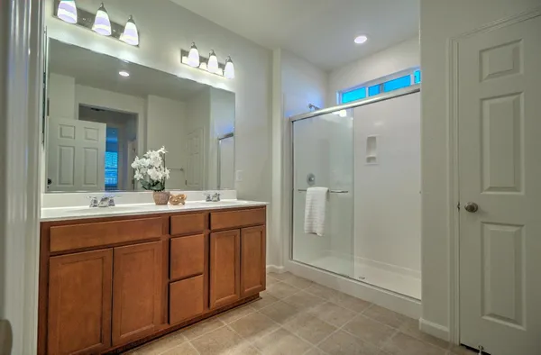 a kitchen with refrigerator and cabinets