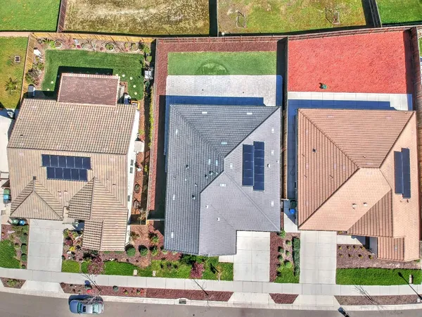 an aerial view of a house with a garden and plants