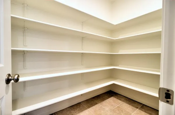 a kitchen with stainless steel appliances granite countertop wooden cabinets a stove top oven a sink and dishwasher