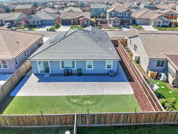 a view of a house with wooden fence
