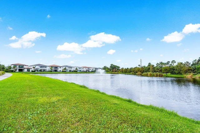 a view of a lake with houses in the back