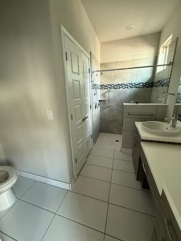 a view of a swimming pool with an outdoor seating and a bench