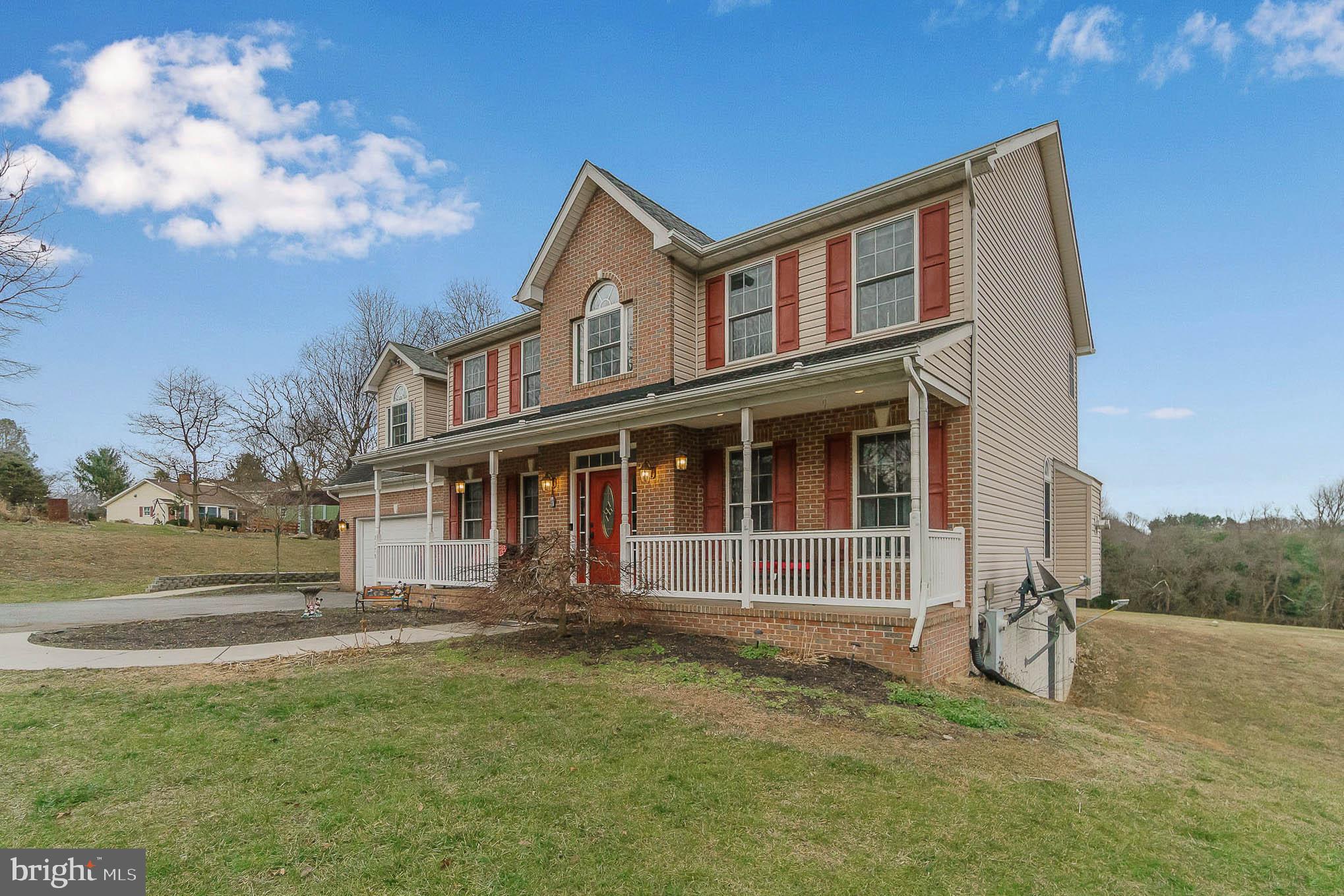 2375 Carrollton Road Westminster, MD 21157 - Photo 2 of 37 a front view of a house with a yard