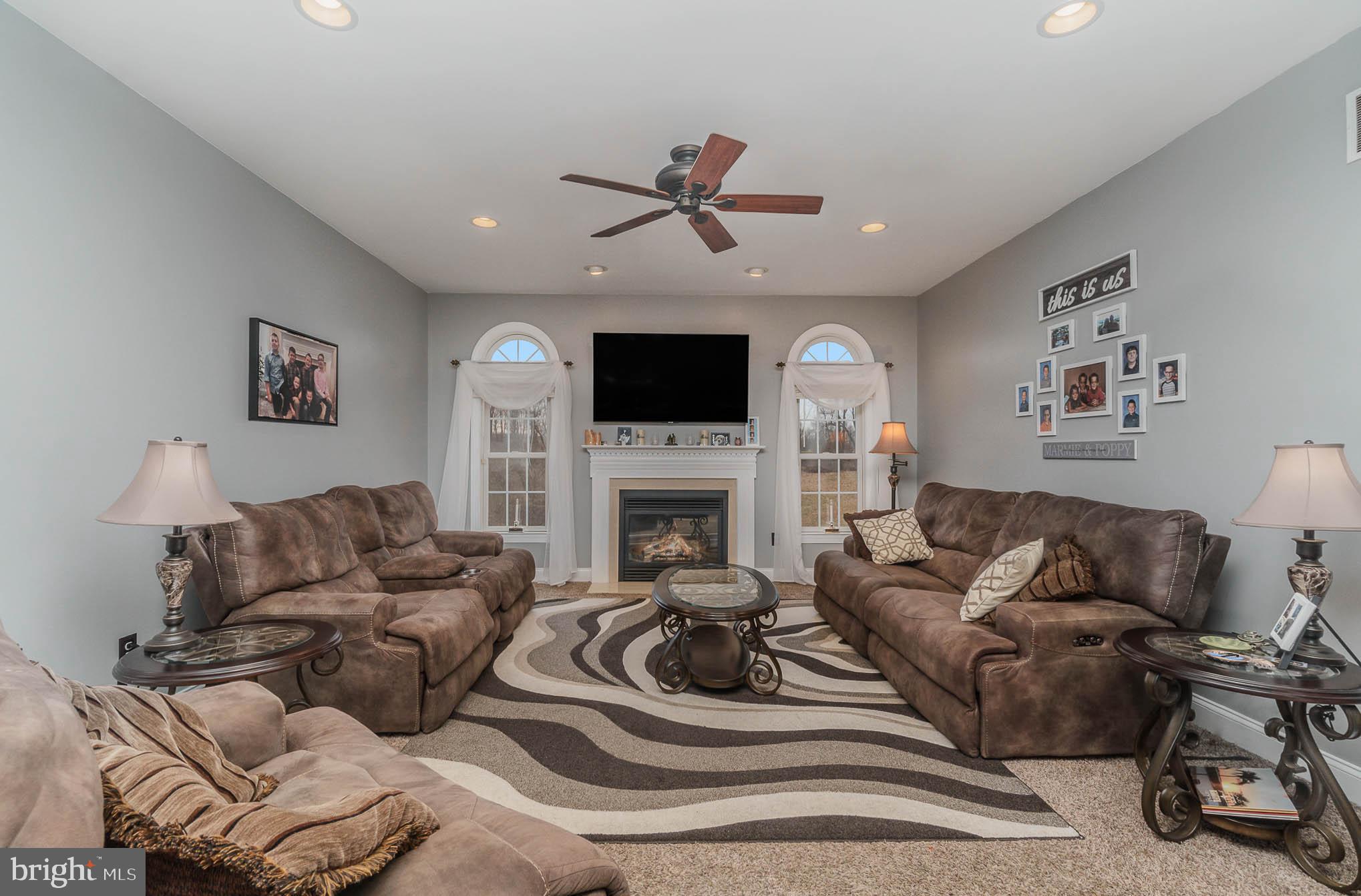 2375 Carrollton Road Westminster, MD 21157 - Photo 12 of 37 a living room with furniture a fireplace and a flat screen tv