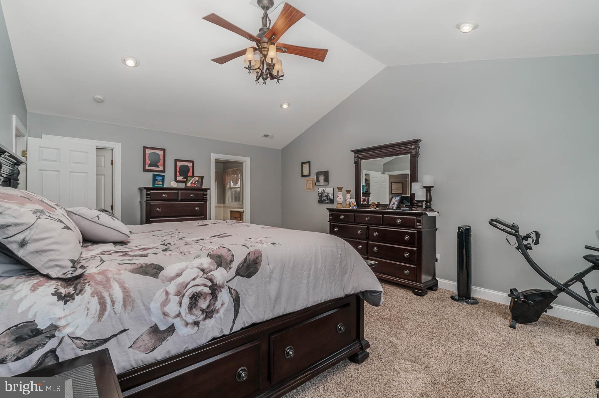 2375 Carrollton Road Westminster, MD 21157 - Photo 17 of 37 a bedroom with a bed and a chandelier