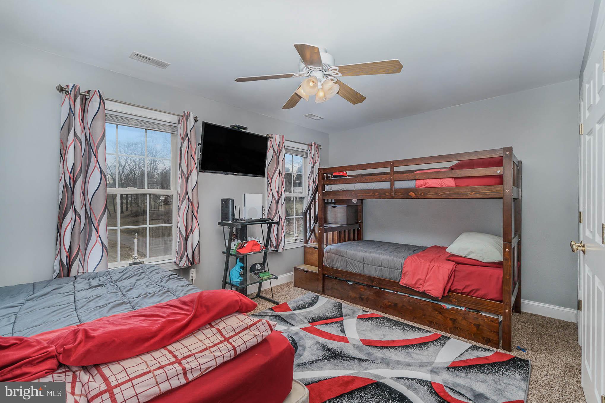 2375 Carrollton Road Westminster, MD 21157 - Photo 20 of 37 a bedroom with furniture and a flat screen tv