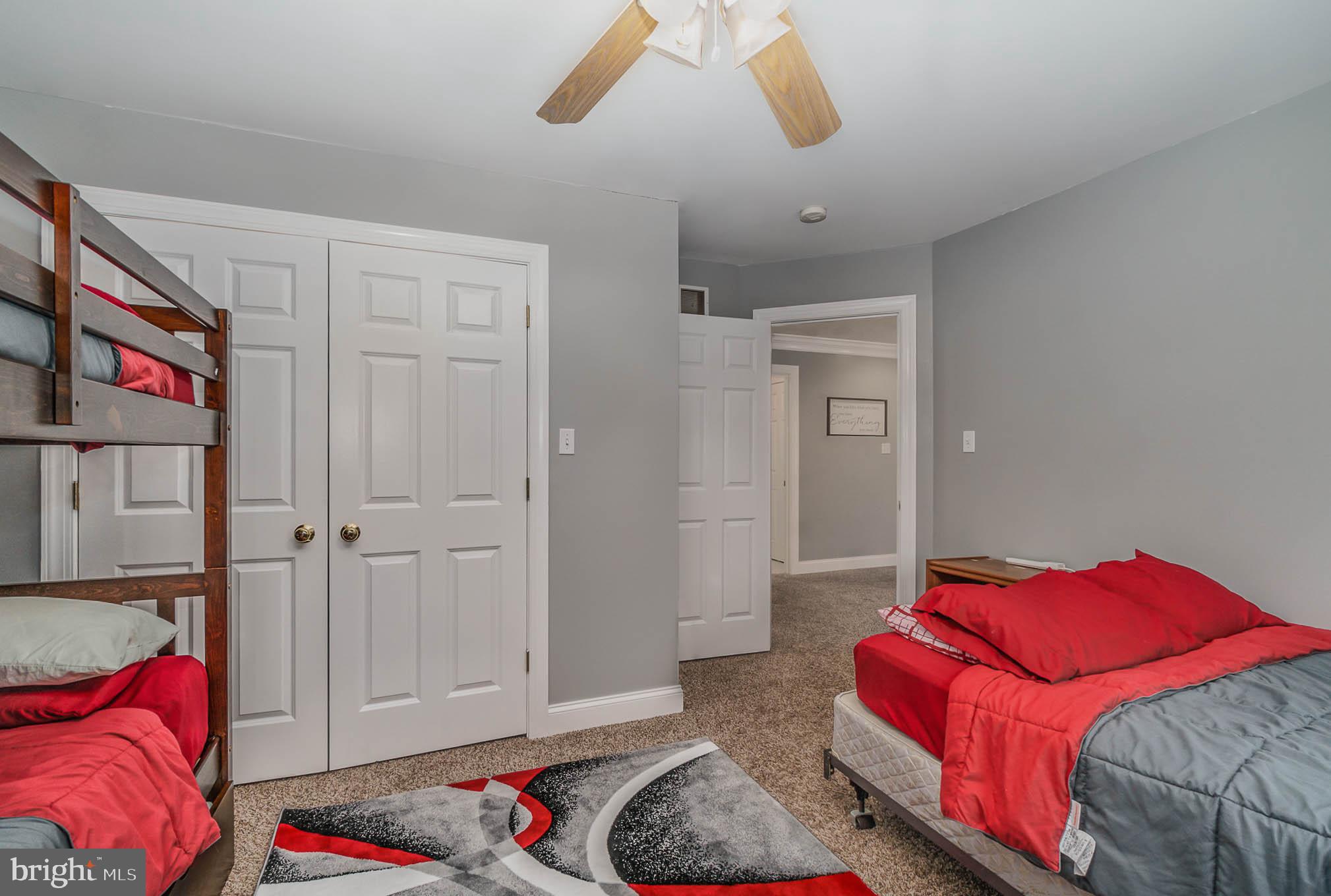 2375 Carrollton Road Westminster, MD 21157 - Photo 21 of 37 a bedroom with a bed and a chandelier