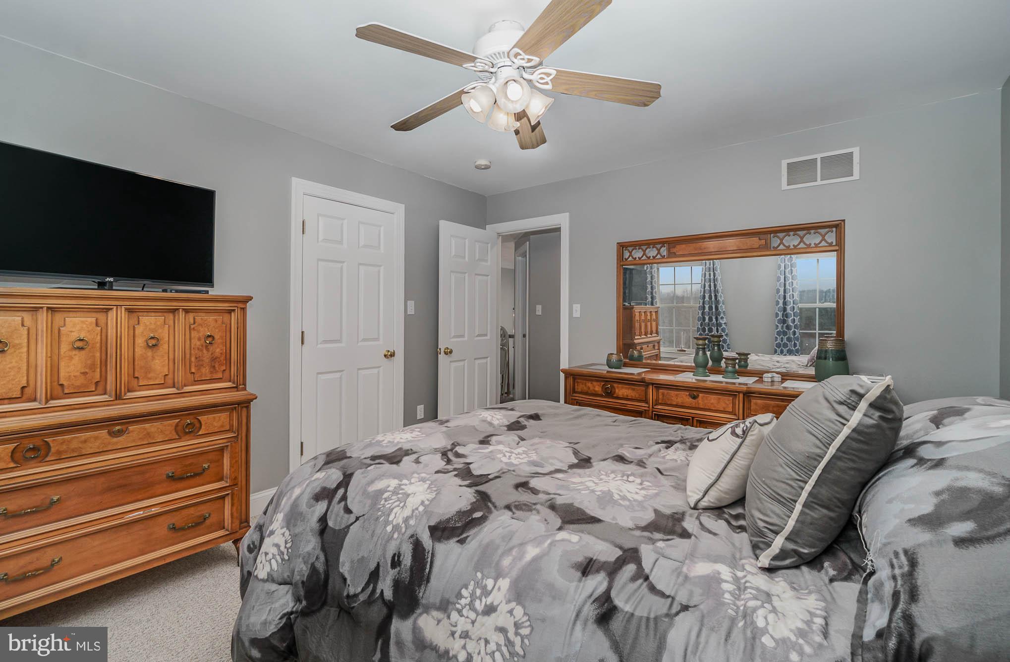 2375 Carrollton Road Westminster, MD 21157 - Photo 23 of 37 a bedroom with a bed and a flat screen tv