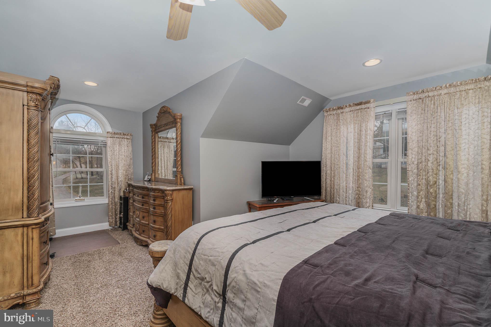 2375 Carrollton Road Westminster, MD 21157 - Photo 24 of 37 a bedroom with a bed dresser and a flat tv screen