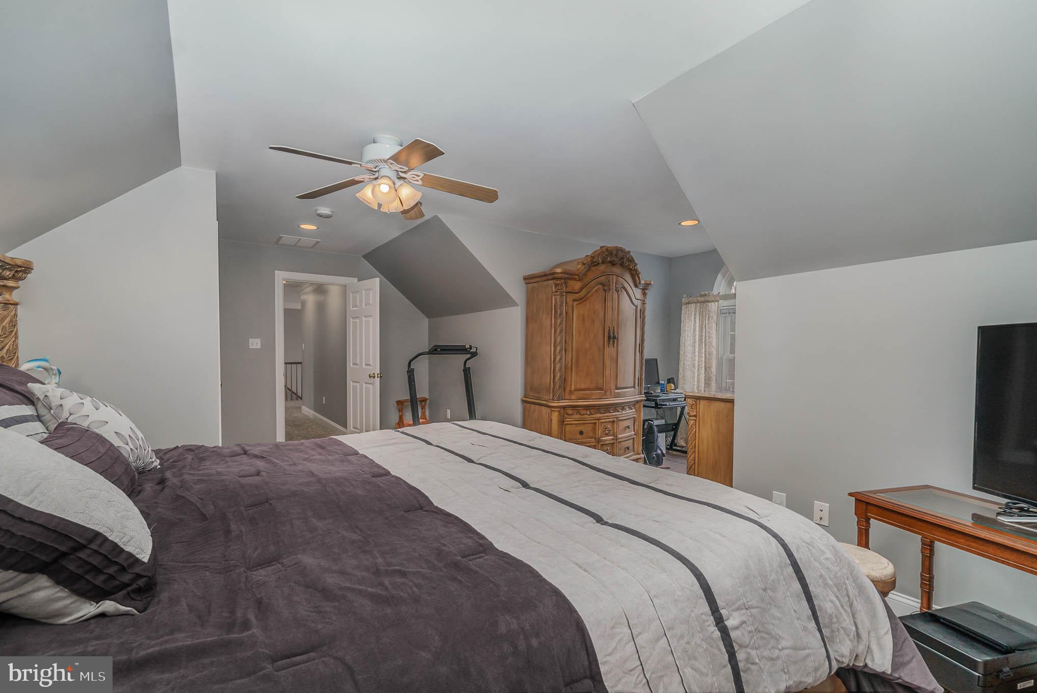 2375 Carrollton Road Westminster, MD 21157 - Photo 25 of 37 a bedroom with a bed and a chandelier