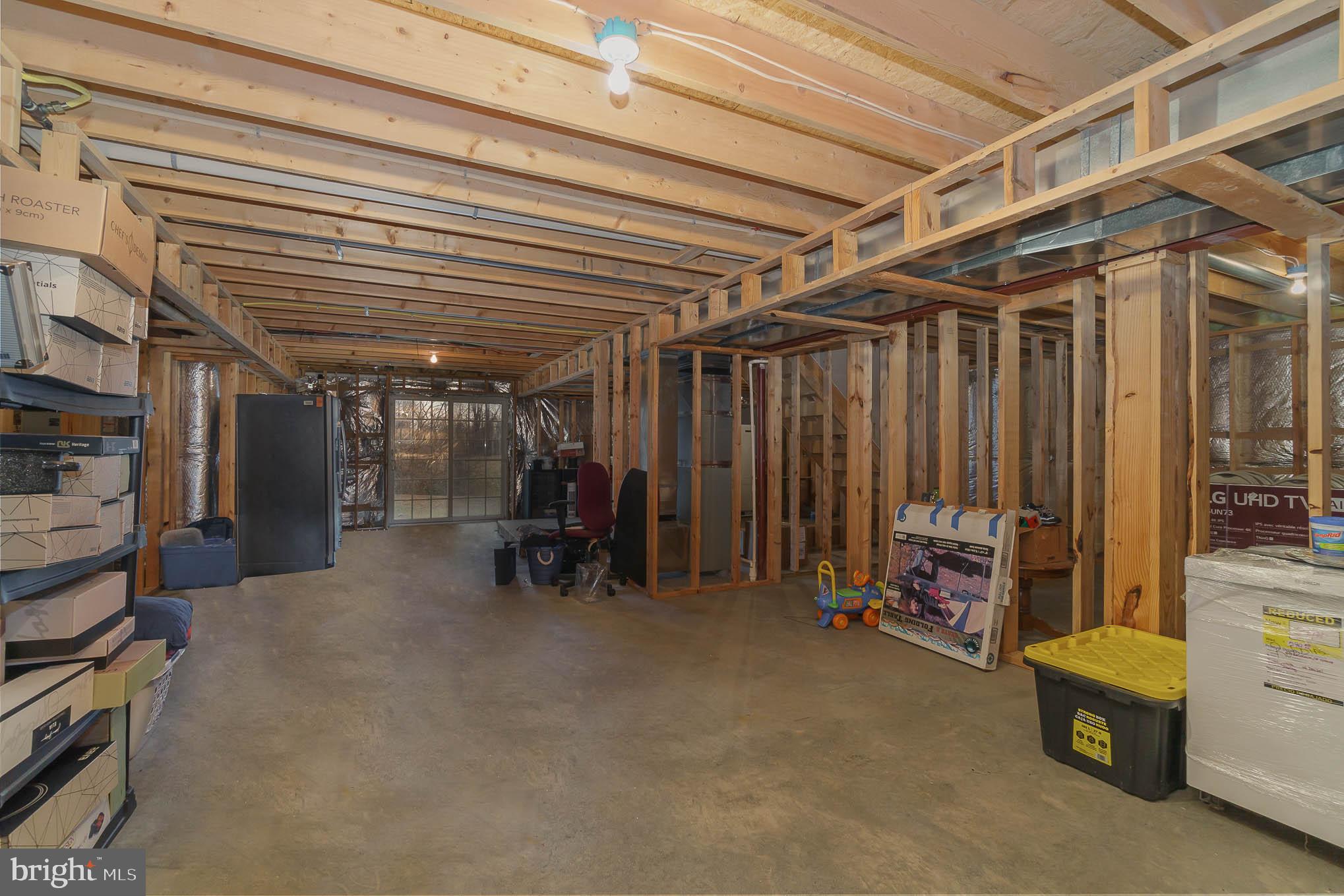 2375 Carrollton Road Westminster, MD 21157 - Photo 27 of 37 a view of a room with furniture and a garage