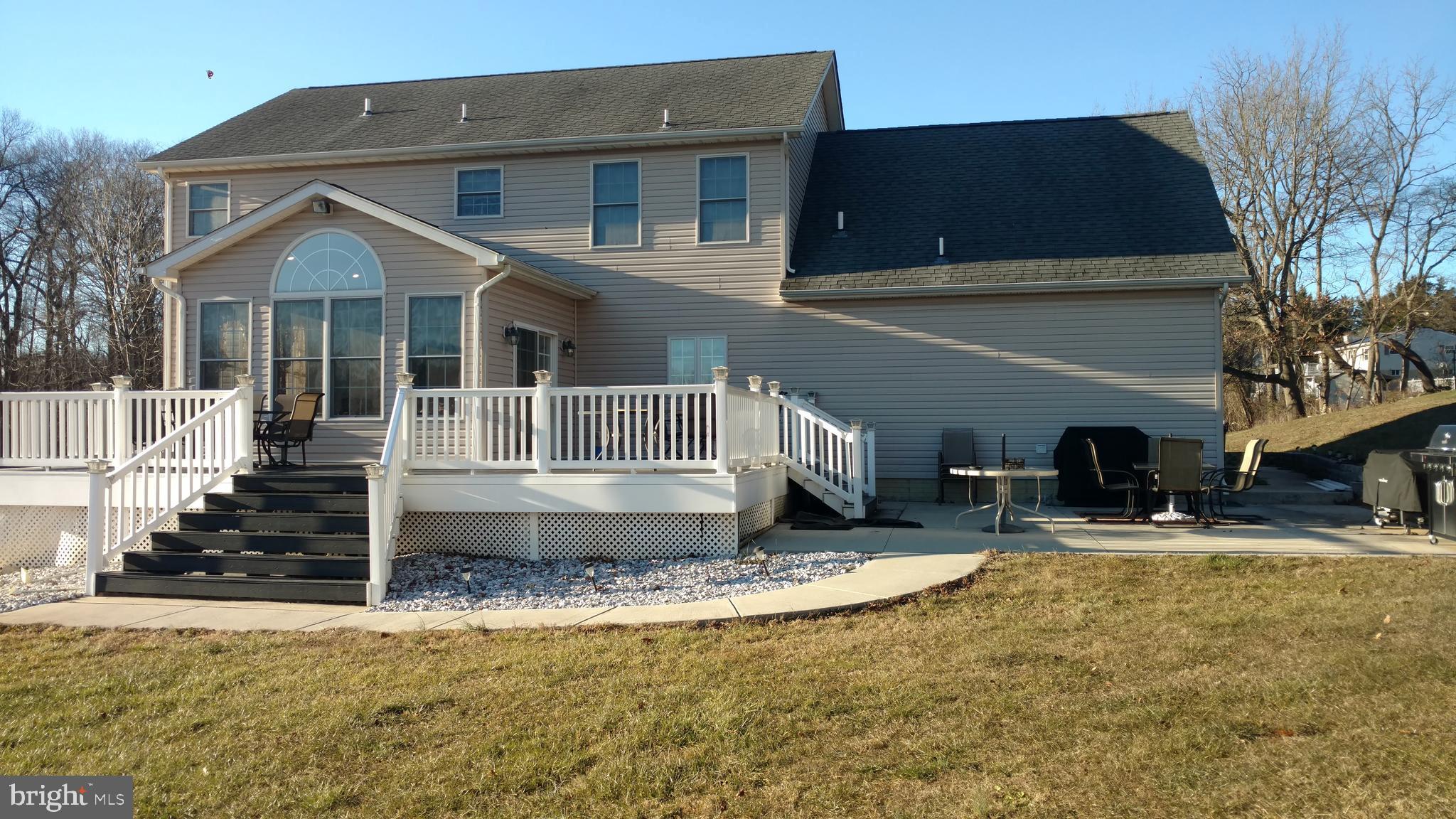 2375 Carrollton Road Westminster, MD 21157 - Photo 28 of 37 a front view of a house with a yard outdoor seating and covered with trees