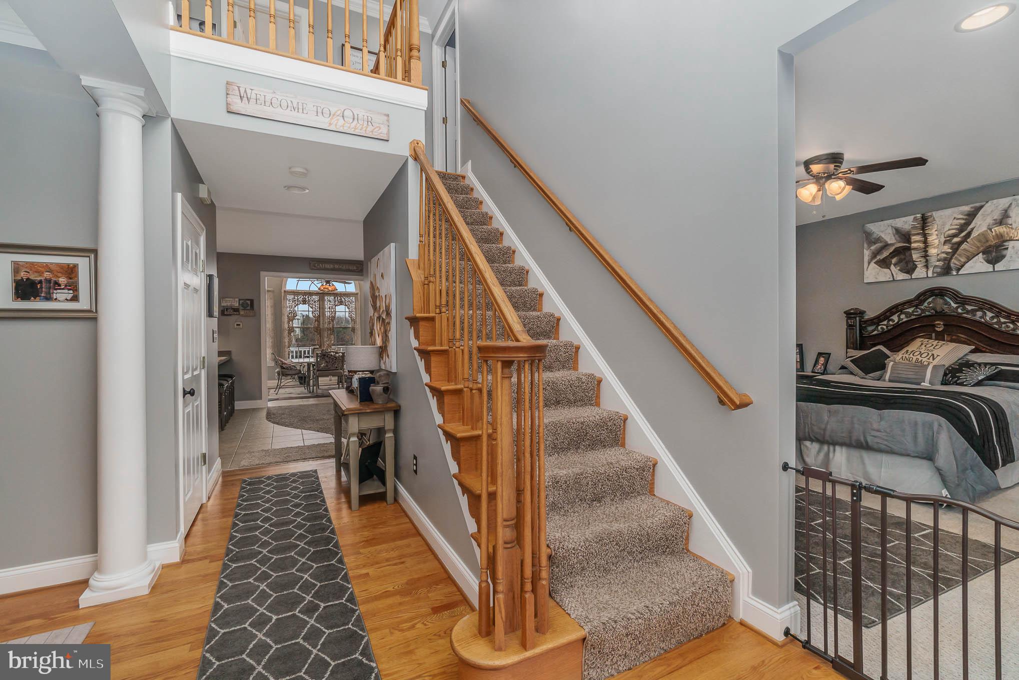 2375 Carrollton Road Westminster, MD 21157 - Photo 4 of 37 a view of a hallway with wooden floor and staircase