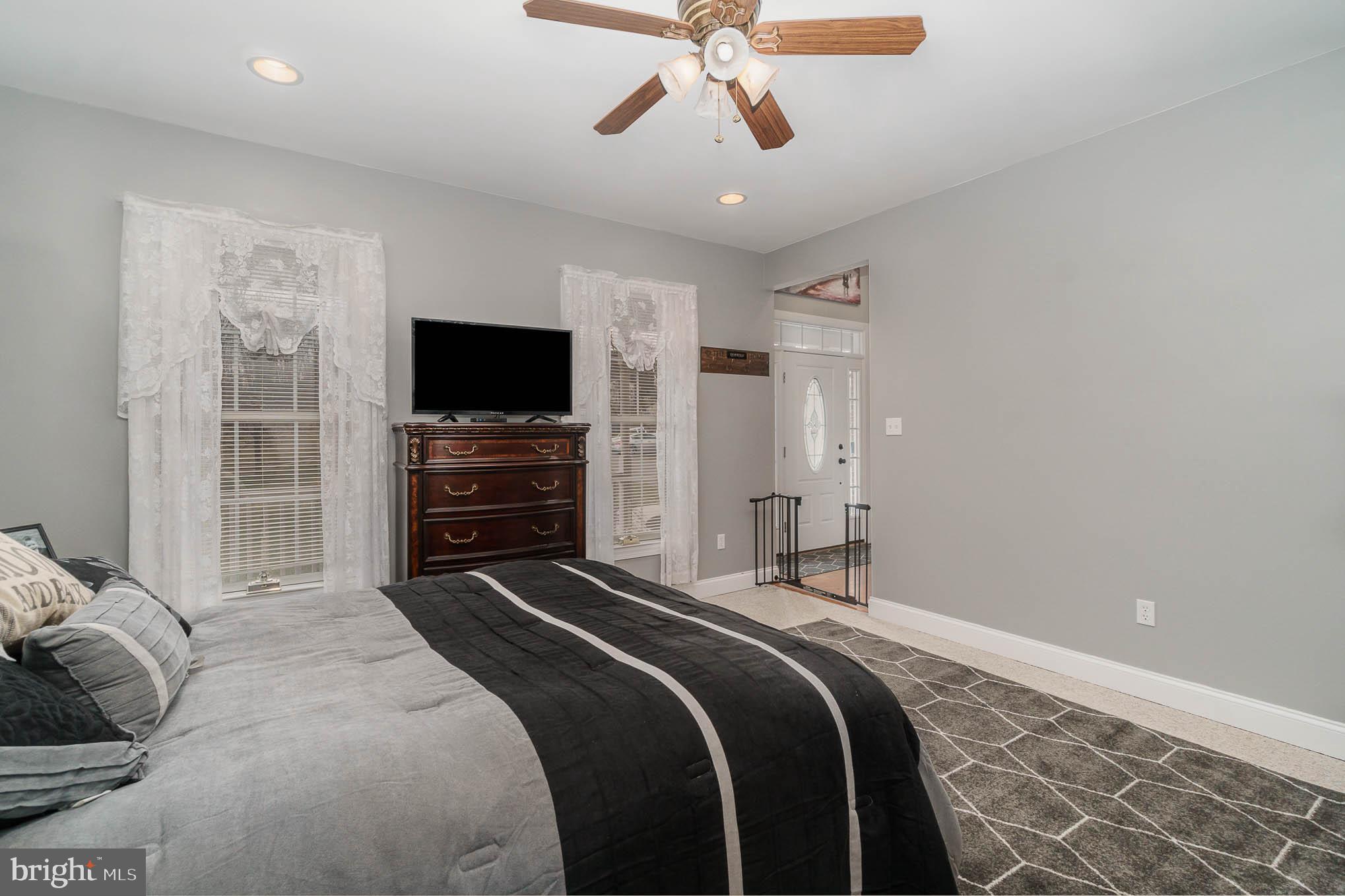 2375 Carrollton Road Westminster, MD 21157 - Photo 6 of 37 a bedroom with a bed and a flat screen tv