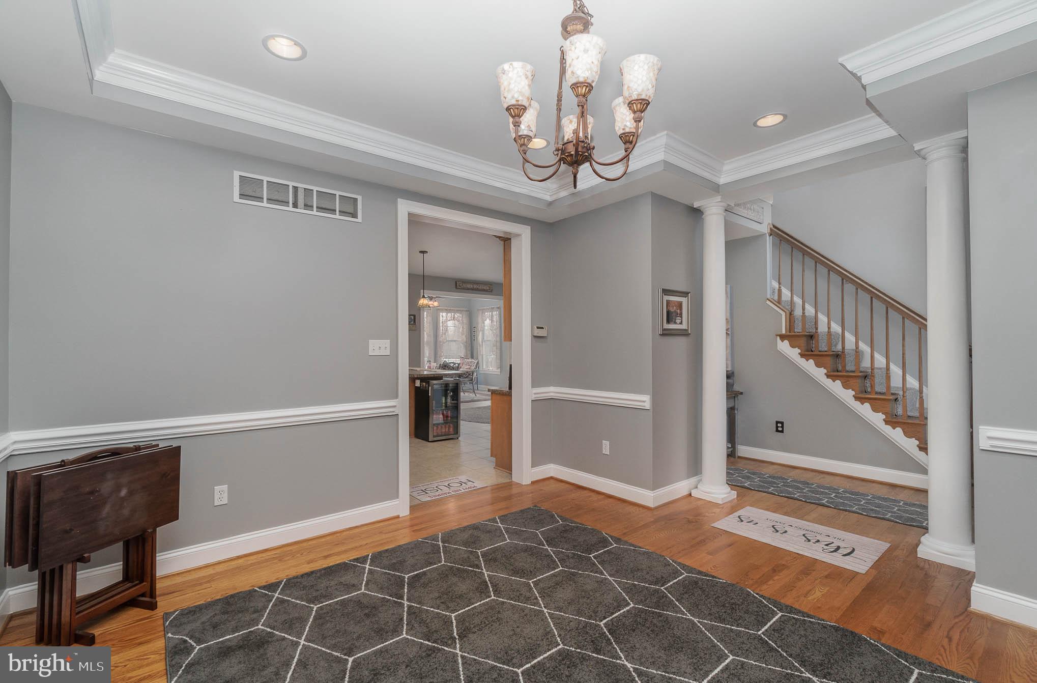 2375 Carrollton Road Westminster, MD 21157 - Photo 8 of 37 a view of a hallway with wooden floor and staircase