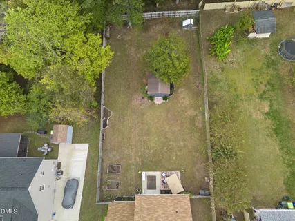 a kitchen with granite countertop a refrigerator and a sink