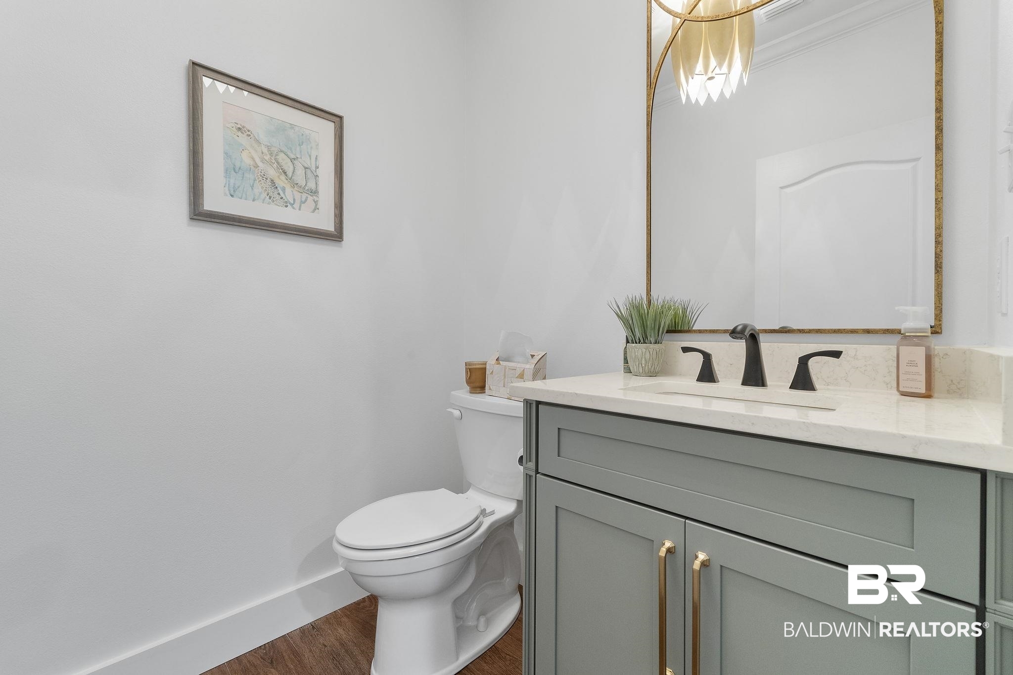 4451 Millhouse Road Gulf Shores, AL 36542 - Photo 32 of 50 Bathroom featuring vanity, hardwood / wood-style flooring, and toilet