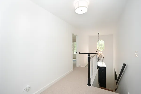 a view of hallway with furniture