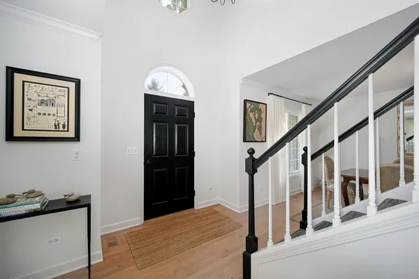 a view of an entryway with wooden floor