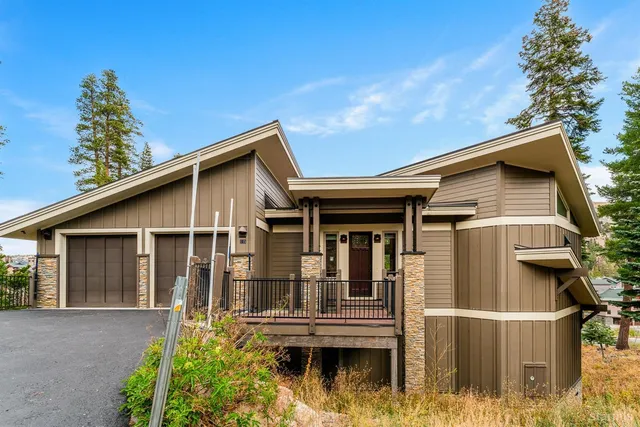 a sitting room with furniture and wooden floor