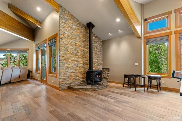 a room with pool table and a chandelier