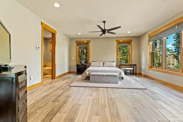 a bedroom with a bed lamp and window