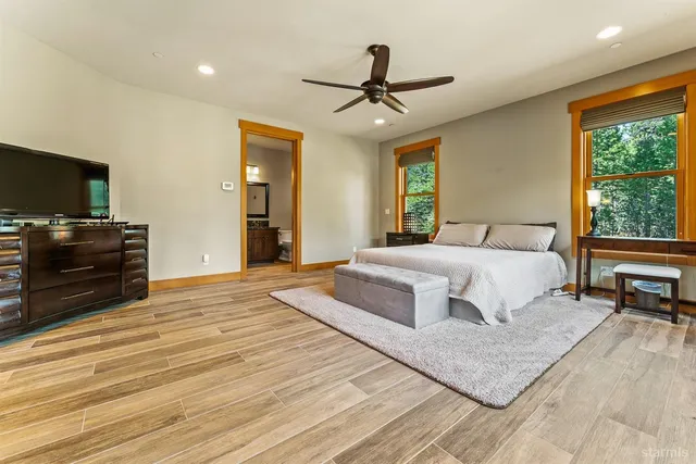 a bedroom with a large bed and a window