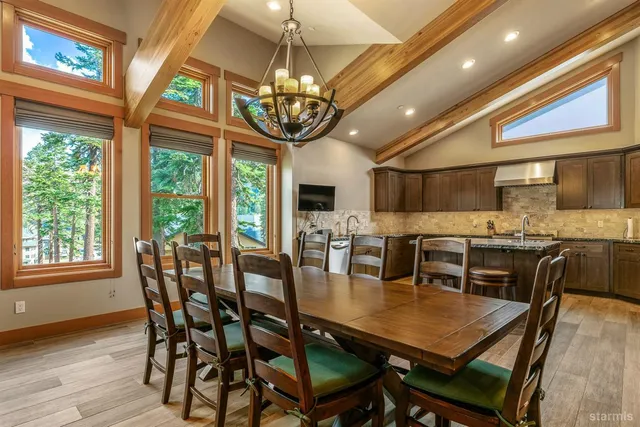 a kitchen with granite countertop stainless steel appliances a sink and counter space