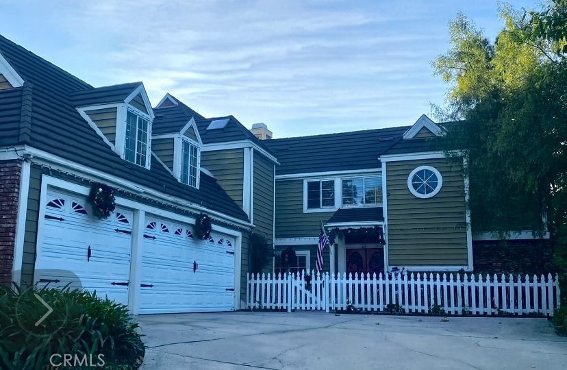 221 South Summertree Road Anaheim, CA 92807 - Photo 1 of 1 a view of a house with a small yard and wooden fence and a large tree