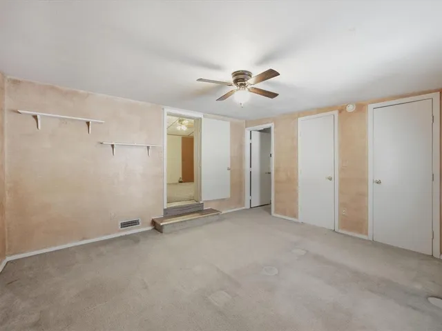 a view of a bathroom with a tub and shower