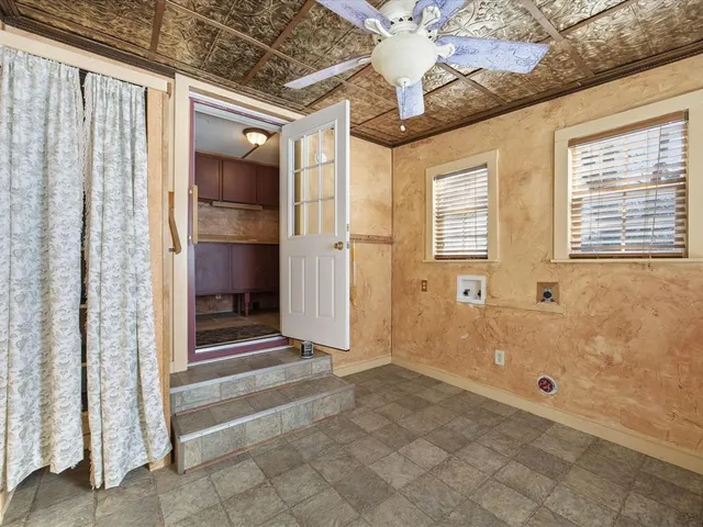 a view of balcony with chairs and wooden floor