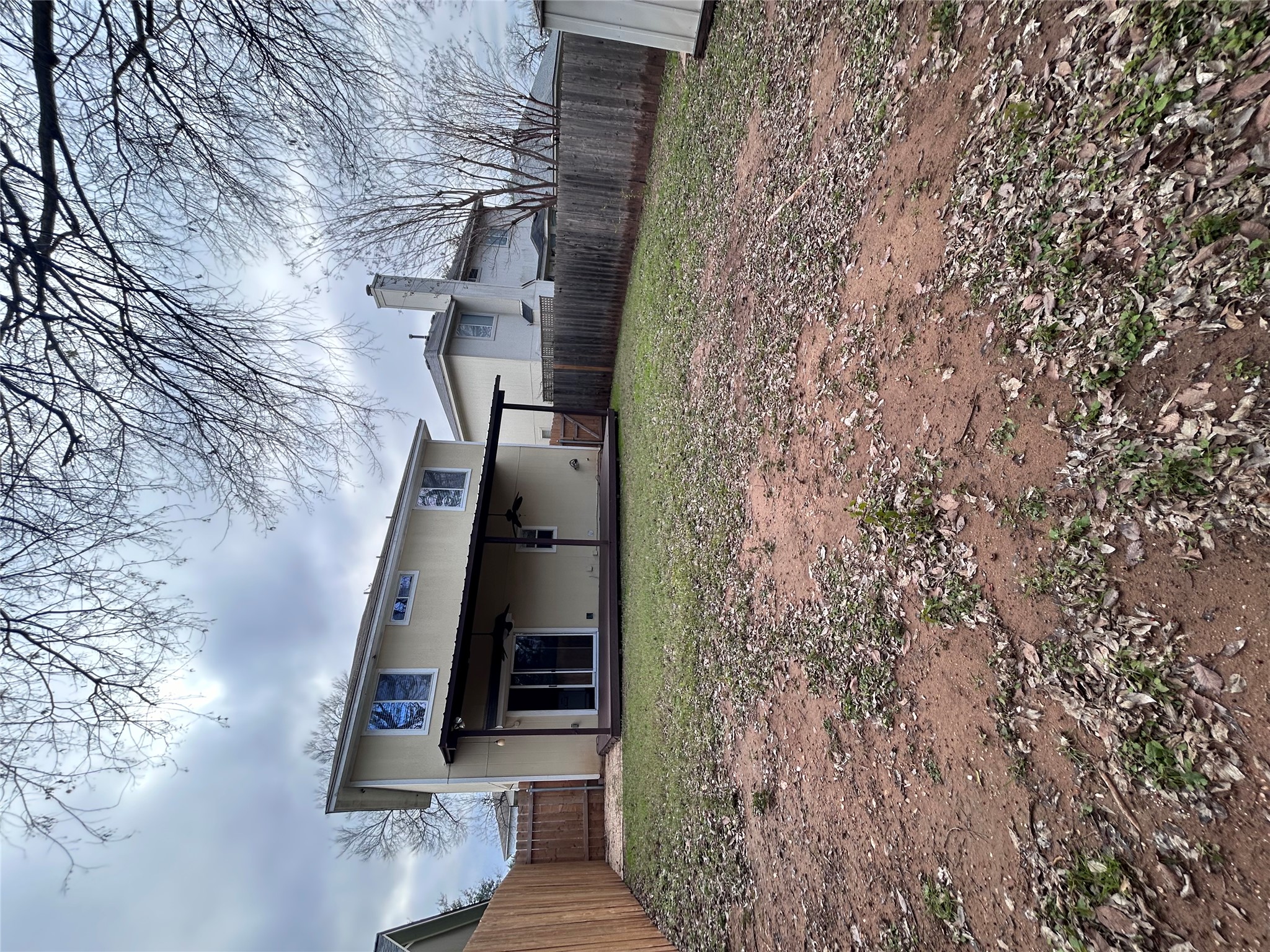 5814 Steven Creek Way Austin, TX 78721 - Photo 15 of 15 a house that has a tree in front of it