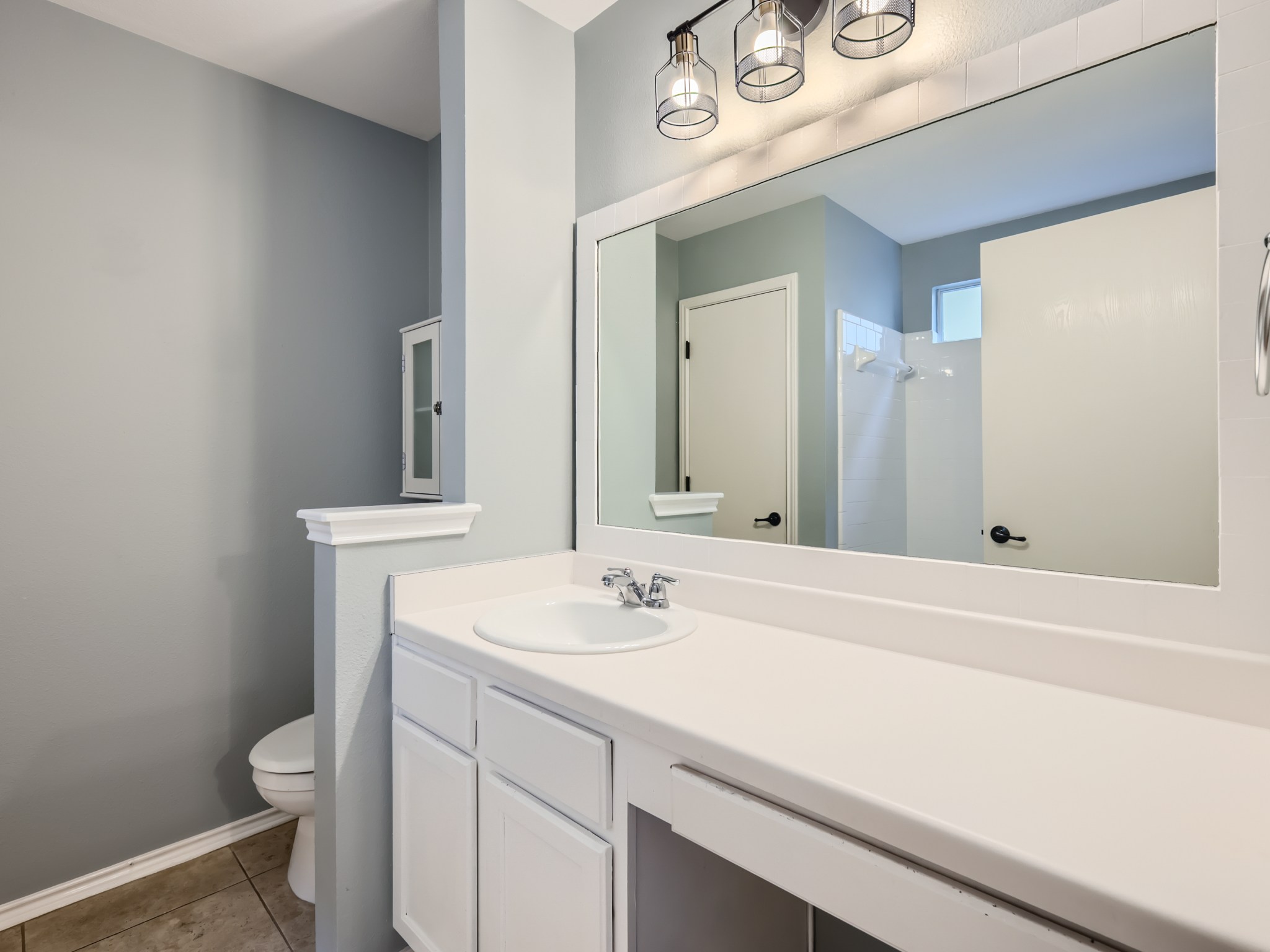 5814 Steven Creek Way Austin, TX 78721 - Photo 5 of 15 a bathroom with a sink and a toilet