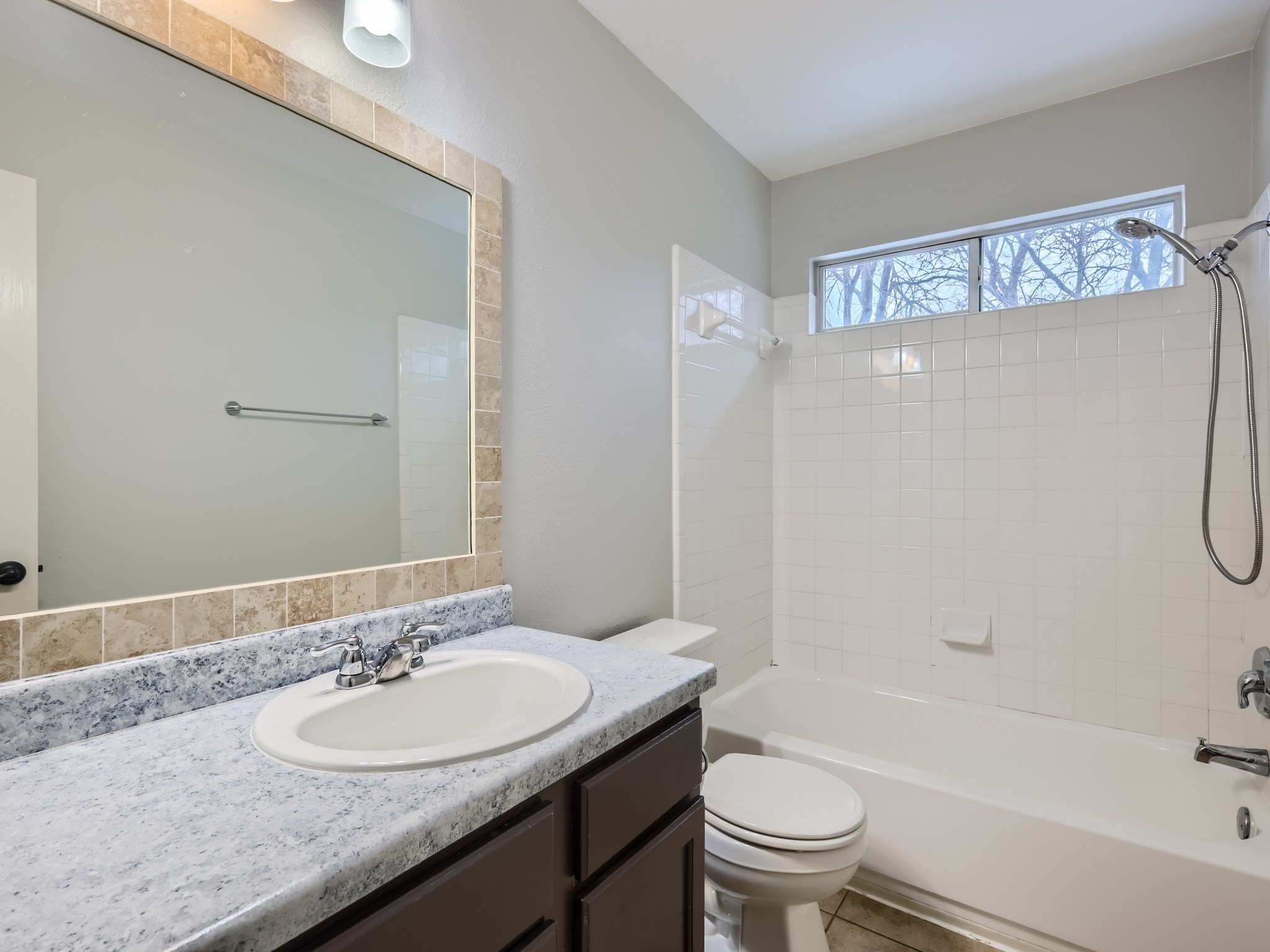 5814 Steven Creek Way Austin, TX 78721 - Photo 8 of 15 a bathroom with a sink a toilet and shower