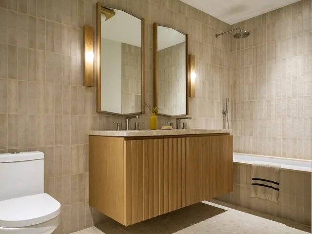 a bathroom with a sink a toilet and mirror