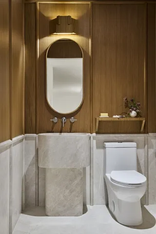 a bathroom with a toilet and a sink