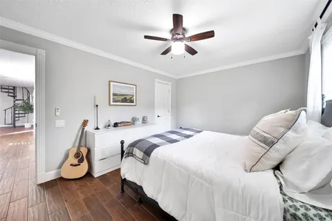 a bed room with a bed and a chandelier