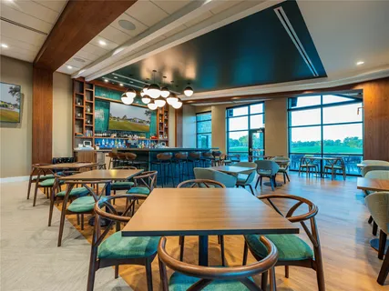 a outdoor dining space with furniture and a potted plant