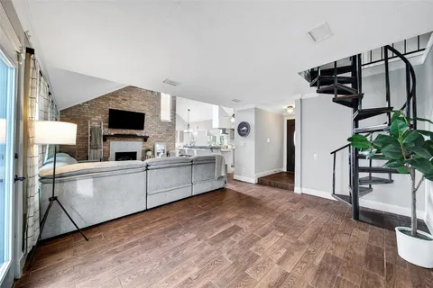 a kitchen with white cabinets and appliances